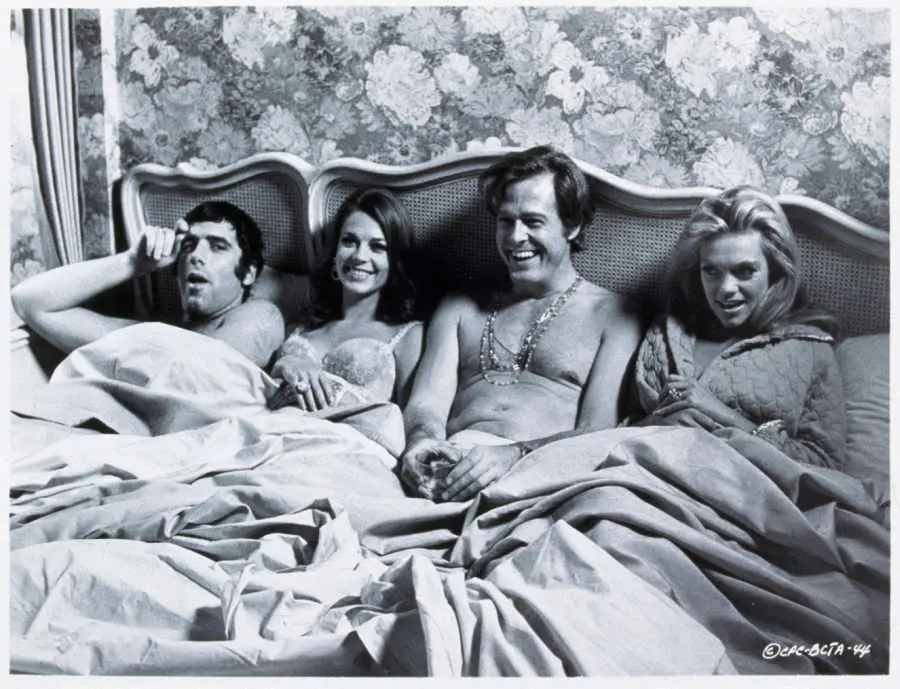swingers in a bed